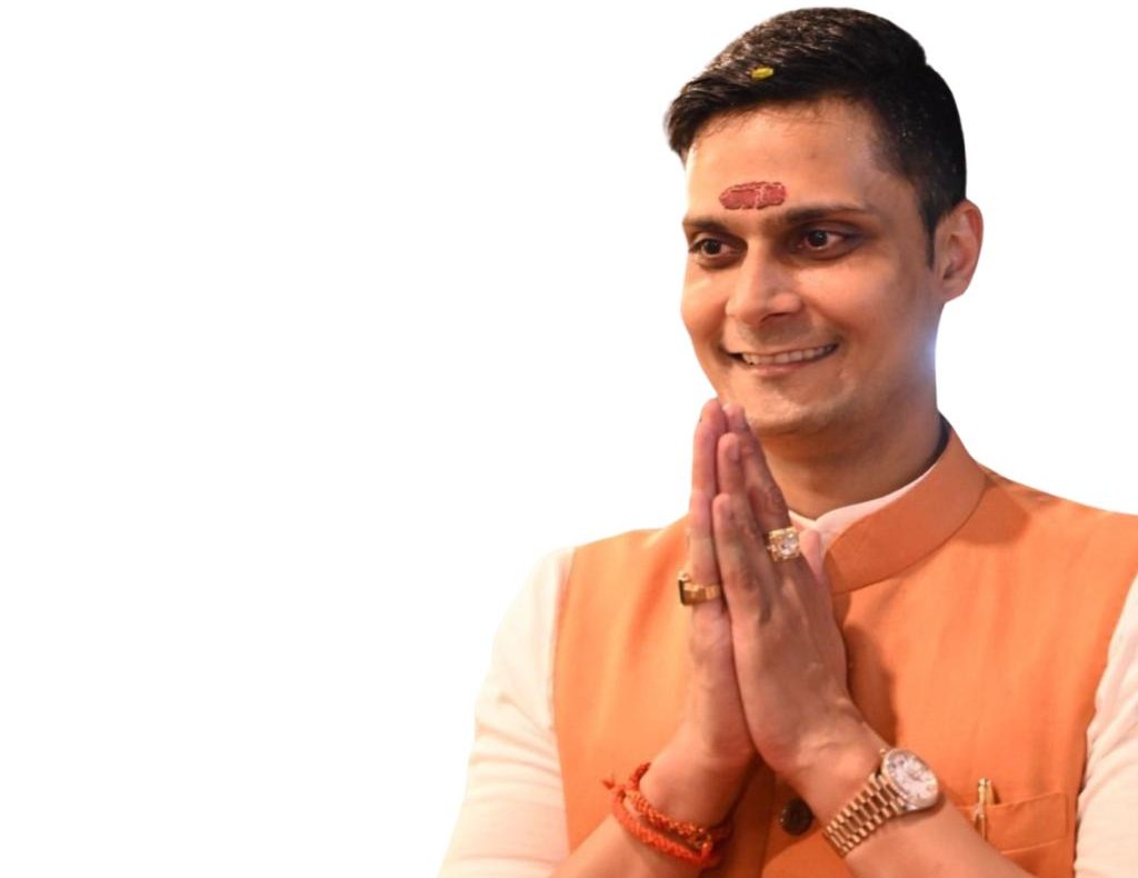 Portrait of Aditya Pareekh greeting with folded hands